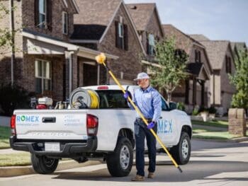 romex truck Pest control worker with truck and equipment.